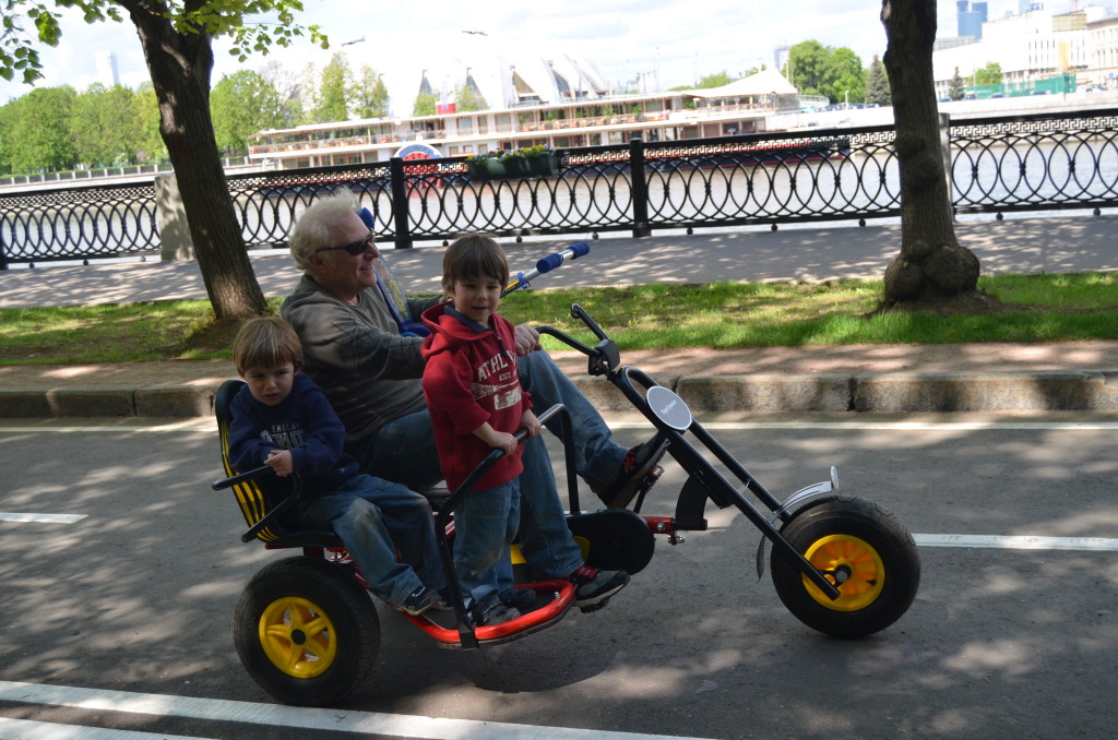 twins riding a bike with sidecar