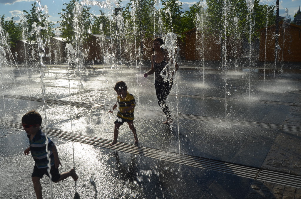 Mara and twins playing in fountain